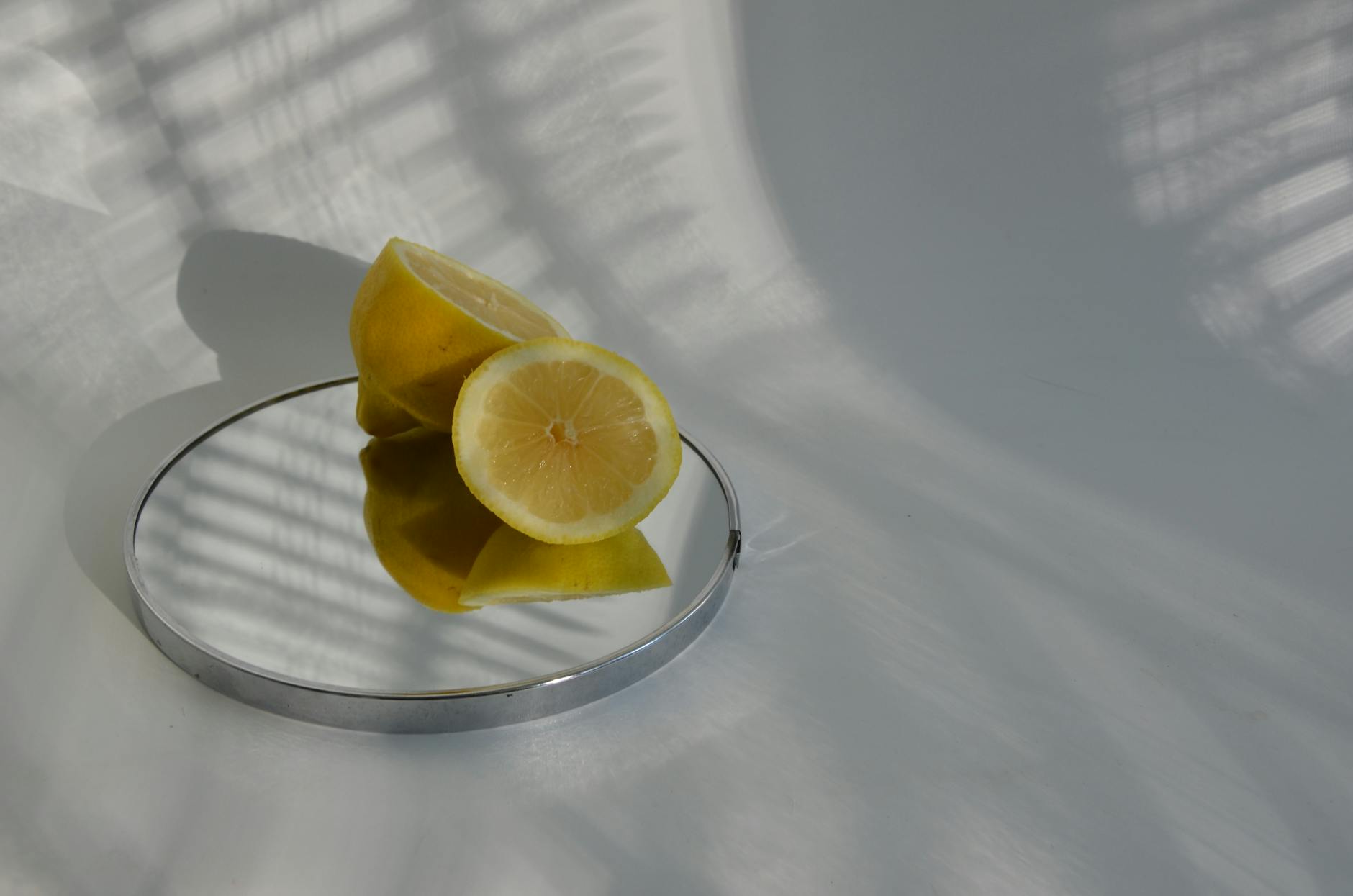 Yellow silicone vibrator surrounded by peeled bananas on a bright yellow background